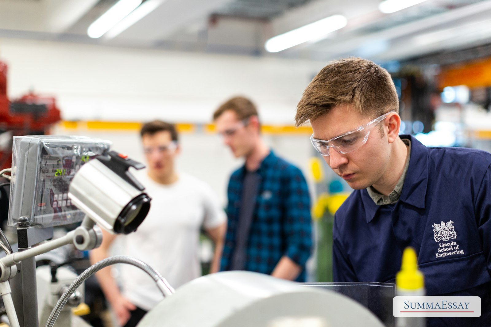 Engineering students working with lab equipment