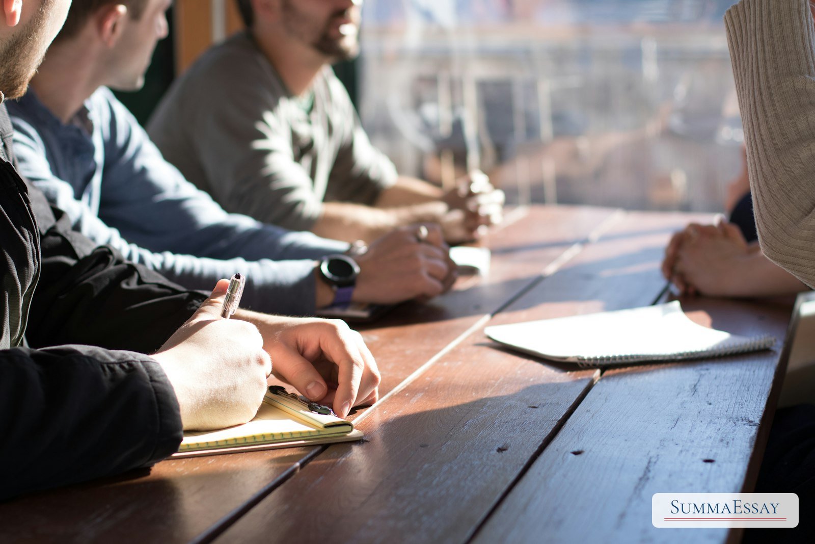 MBA applicants reviewing notes together at a table